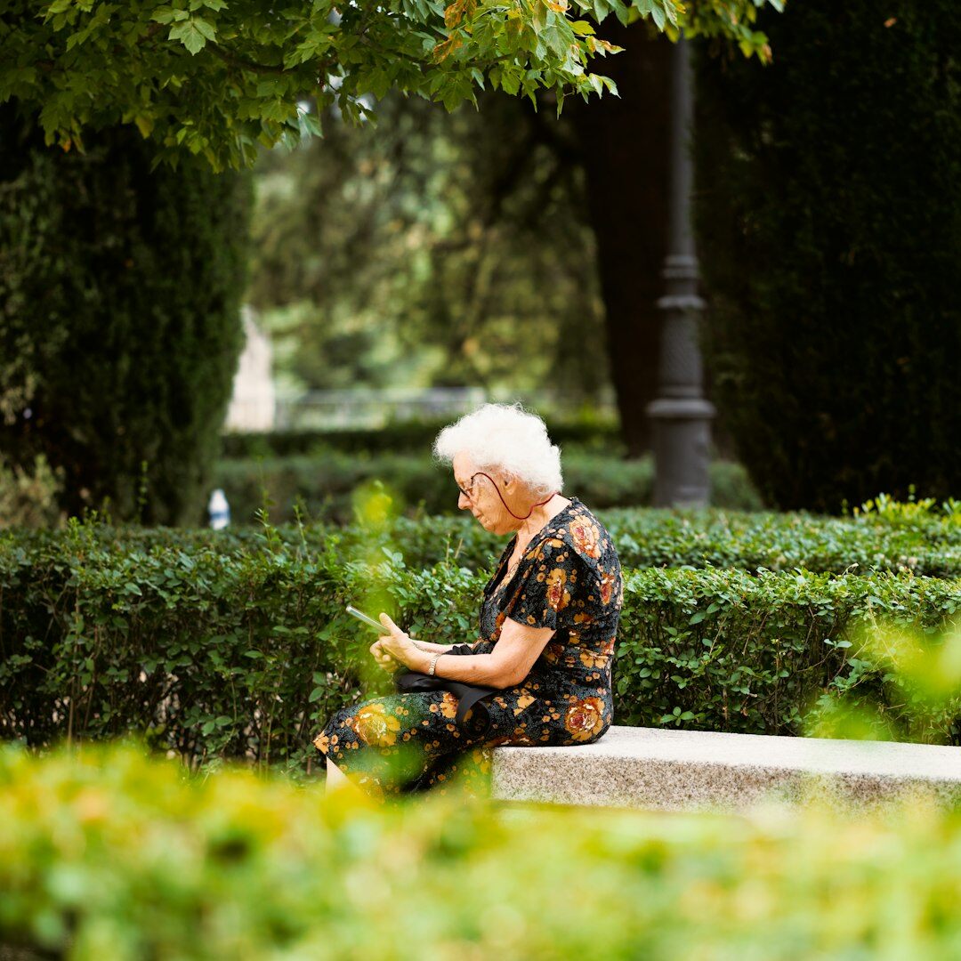 Croatian senior woman using a tablet at home to register for an event