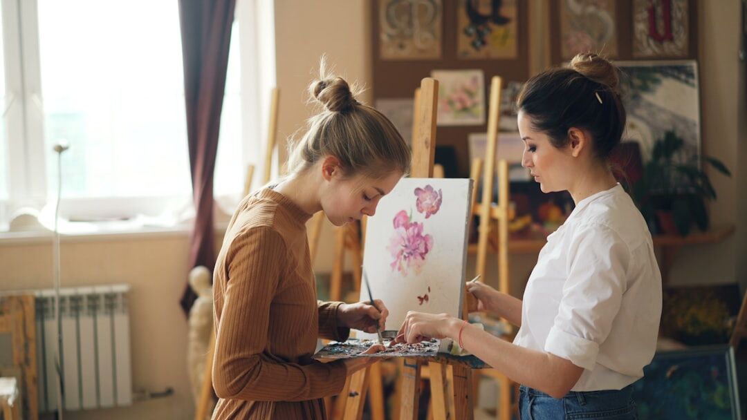 senior woman painting in art class
